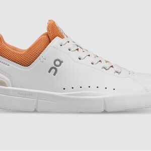 On Running White and Orange Sneakers